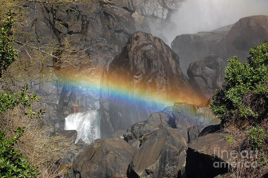 Rainbow Across Rock Photograph by Debra Thompson