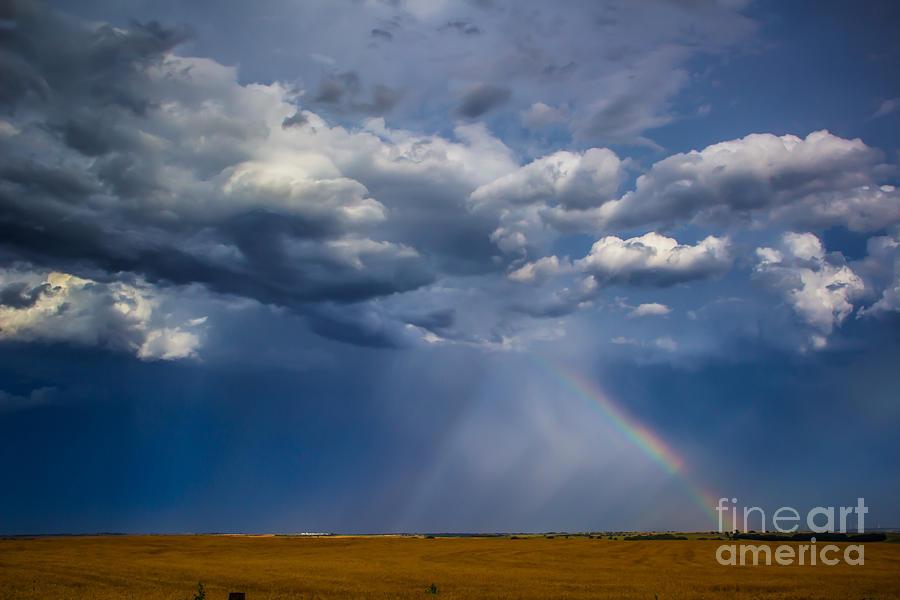 Rainbow and Dark Skies Photograph by Jim McCain