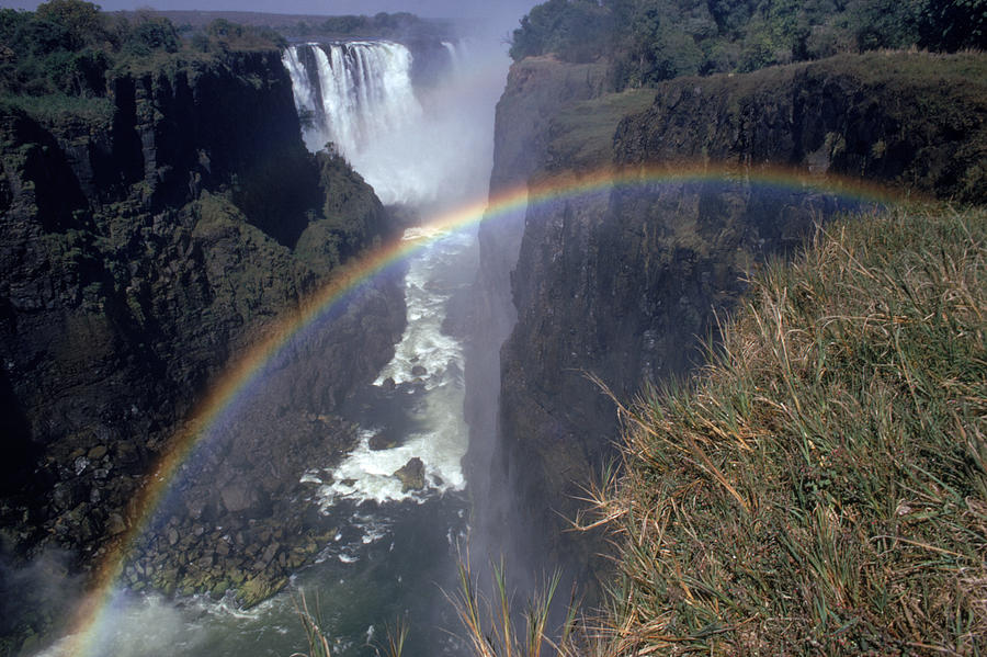 Rainbow At Victoria Falls Photograph by George Holton