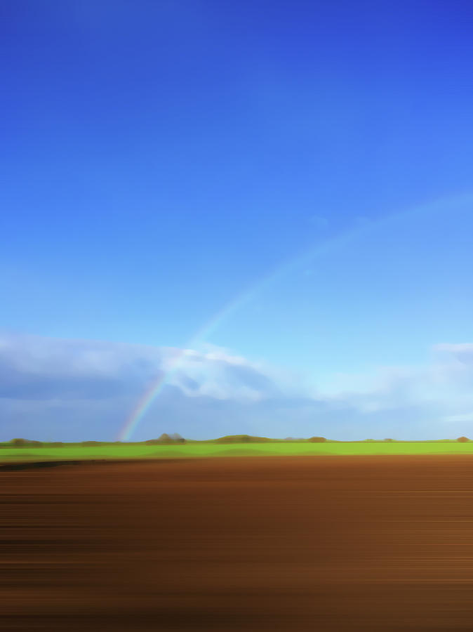 Rainbow In Field Photograph by Ikon Ikon Images