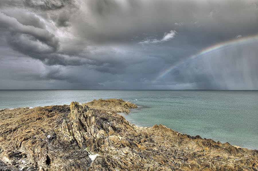 Rainbow in storm clouds Pointe de Saint Cast  Photograph by Gary Eason