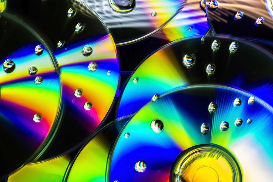 Rainbow of colors on a cd abstract Photograph by Sven Brogren