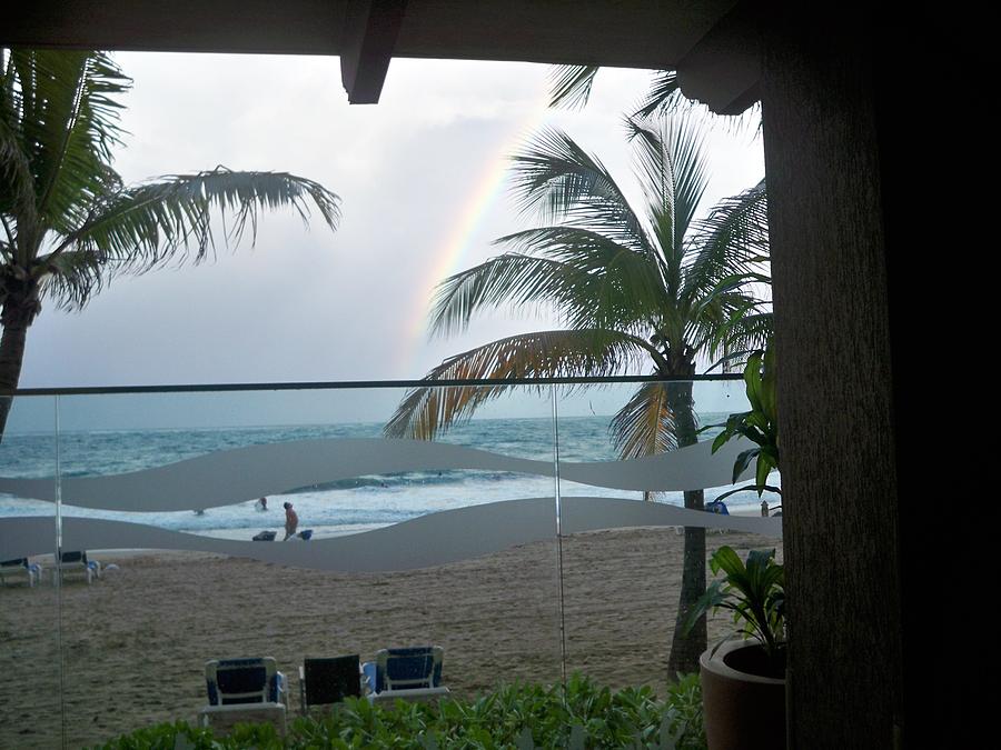 Rainbow on Puerto Rico beach Photograph by Nancy Graham
