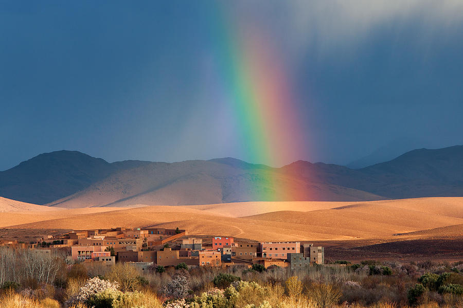 Rainbow over Morocco village in desert Photograph by Danm