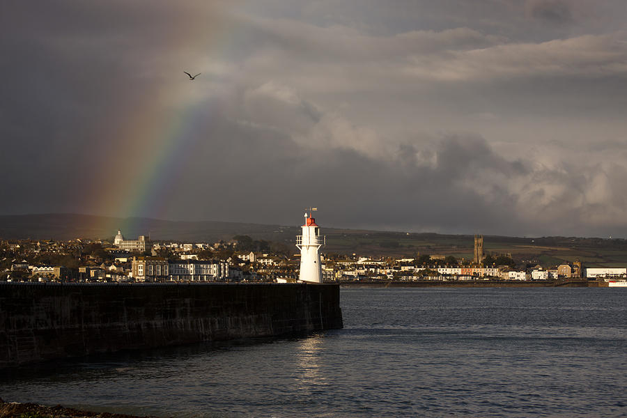 Rainbow over Newlyn Harbour Lighthouse Photograph by Tony Mills