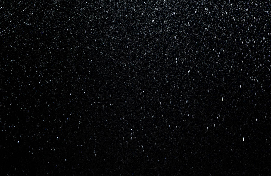 Raindrops falling down on black background Photograph by DarioEgidi
