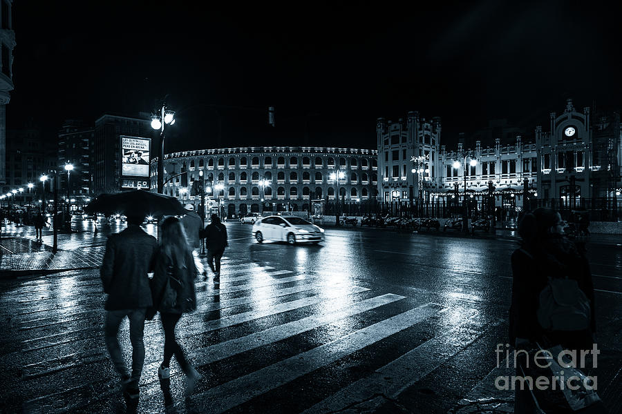 Rainy night on the streets of Valencia Photograph by Peter Noyce