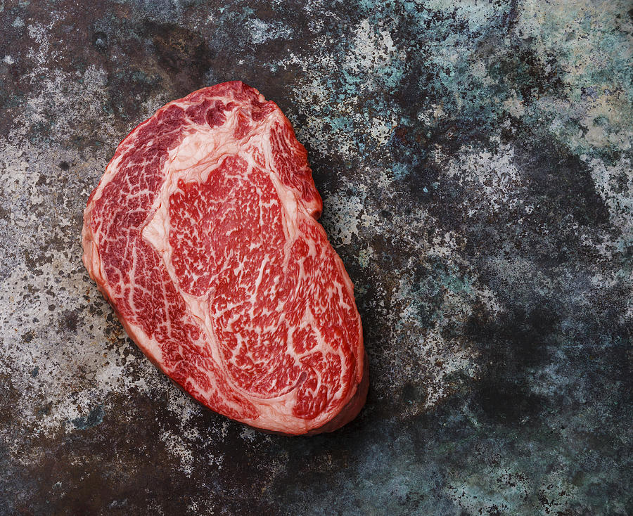 Raw fresh marbled meat Steak Ribeye Black Angus on metal background Photograph by The Picture Pantry