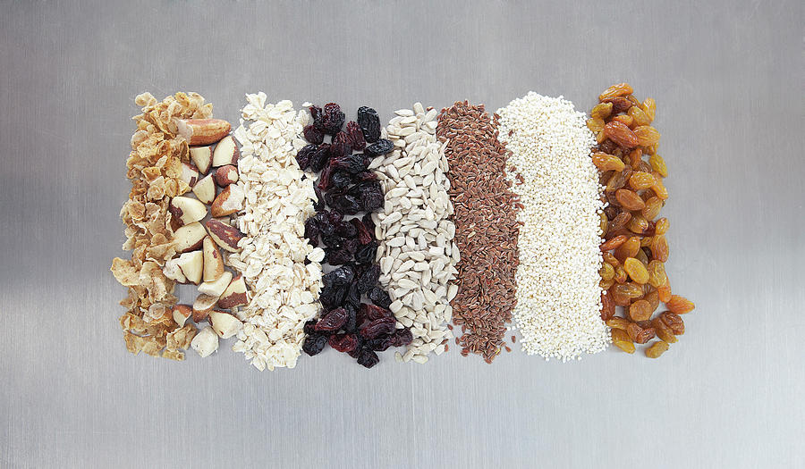 Raw Nuts, Dried Fruit And Grains Photograph by Laurie Castelli