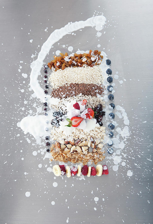 Raw Nuts, Fruit And Grains With Cream Photograph by Laurie Castelli