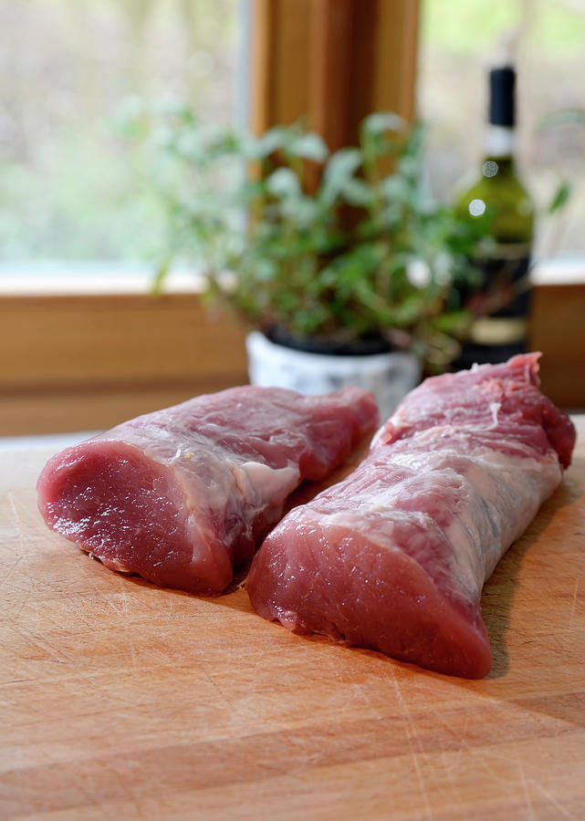 Raw Pork Fillet On Table Photograph by Westend61