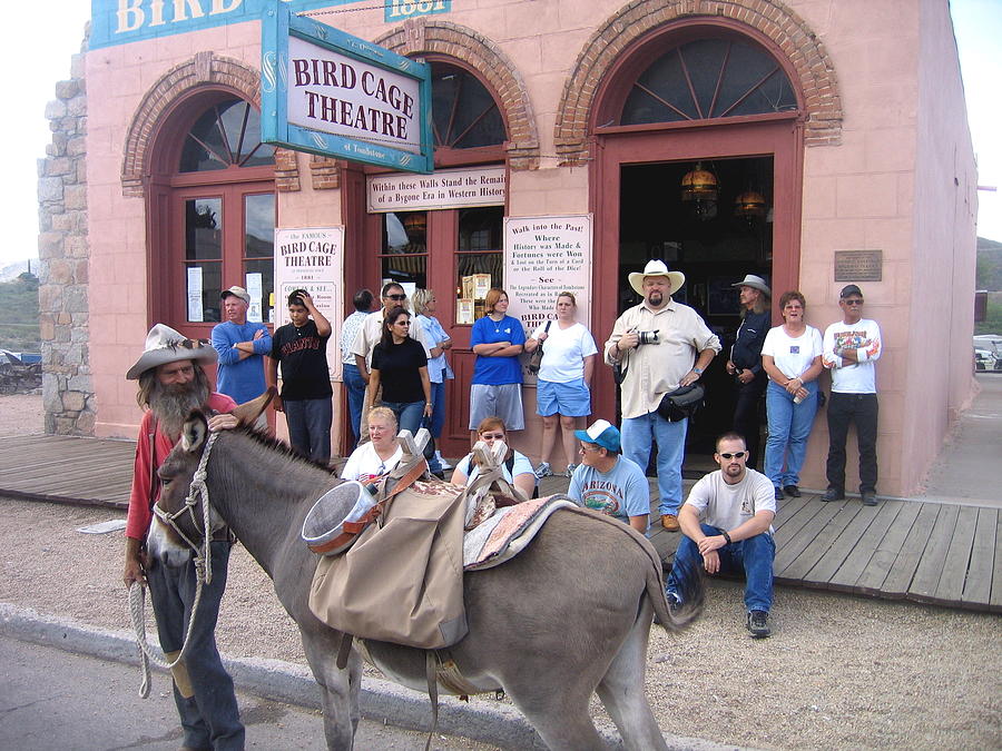 Re-enactor prospector with burro parked in front of Birdcage Theater Tombstone Arizona 2004  Photograph by David Lee Guss