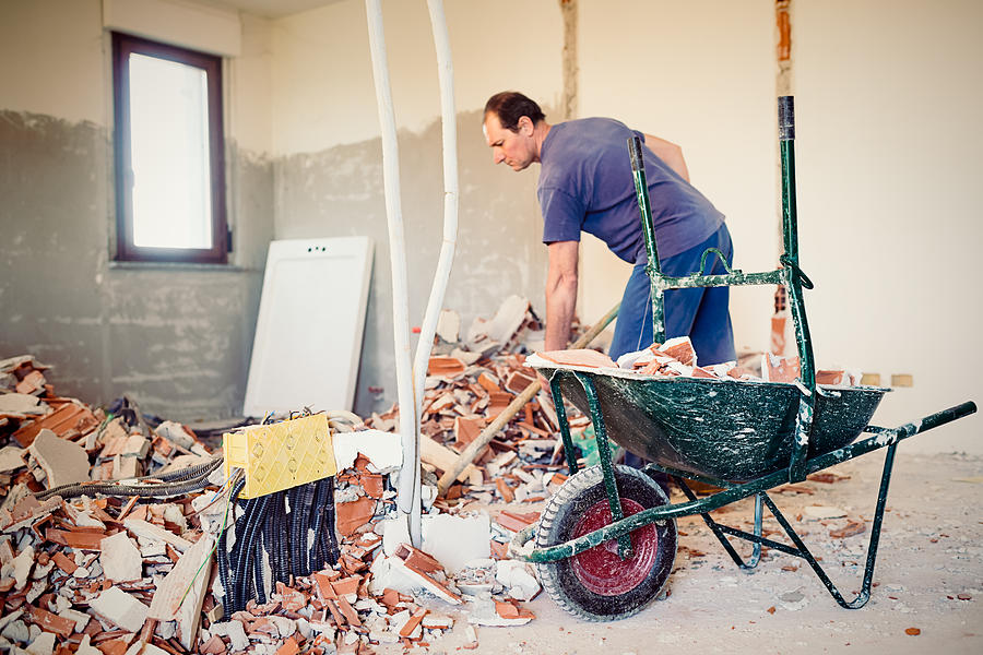 Real Italian worker repairing apartment Photograph by LaraBelova