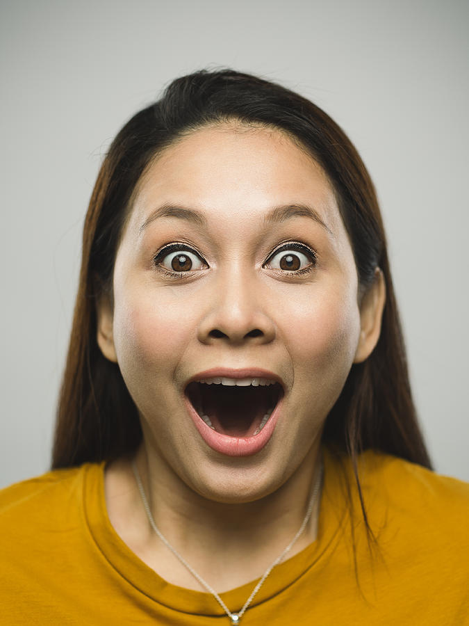 Real malaysian young woman with surprised expression Photograph by SensorSpot