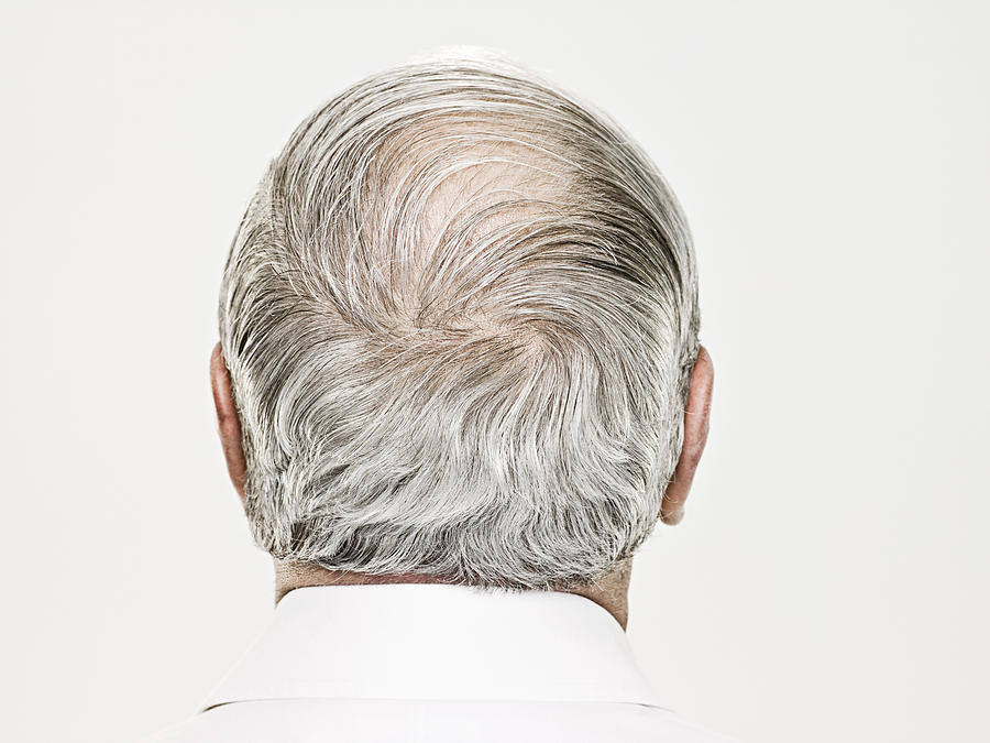 Rear view of a balding senior man Photograph by Image Source