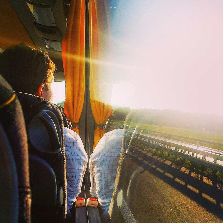 Rear View Of Man Looking Through Bus Photograph by Katerina Saranti / Eyeem