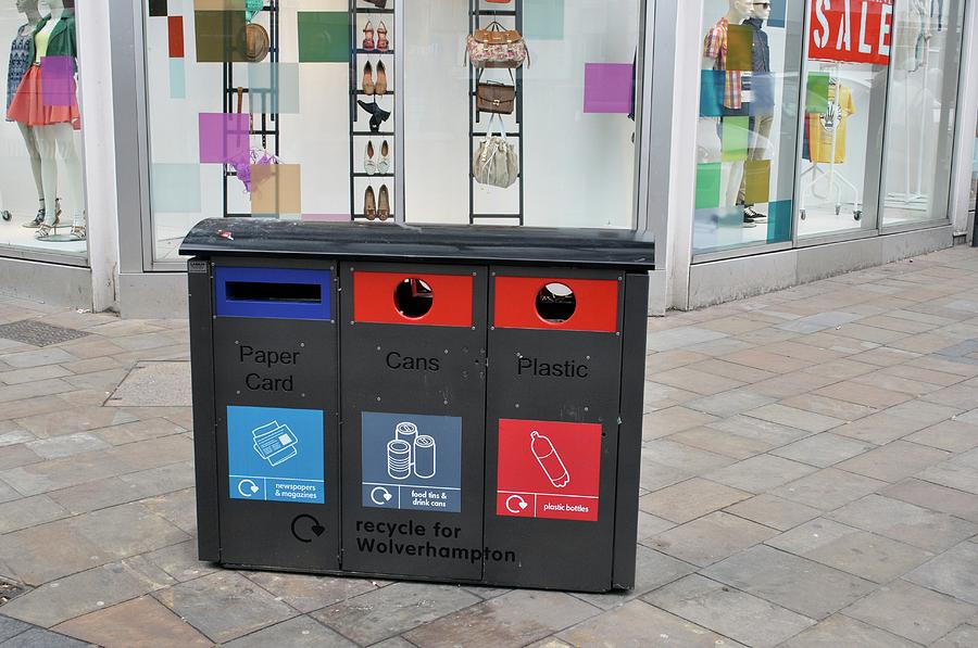 Recycling Bins In Front Of Fashion Shop Photograph by Robert Brook/science Photo Library
