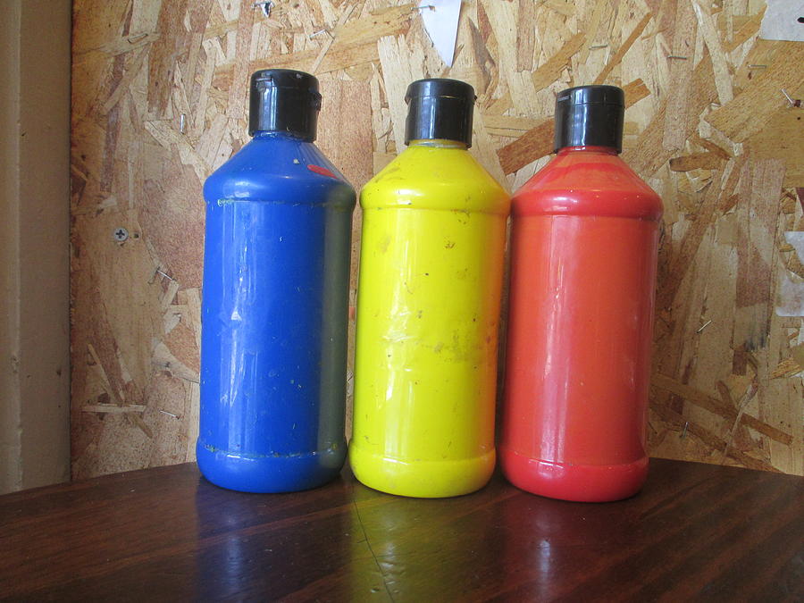 Red and Yellow and Blue Acrylic Paint Bottles by David Lovins