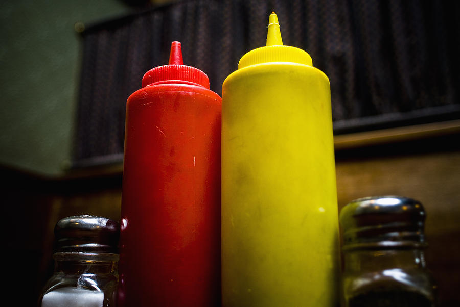 Red and yellow squeeze bottles containing ketchup Photograph by Sam Bloomberg-Rissman