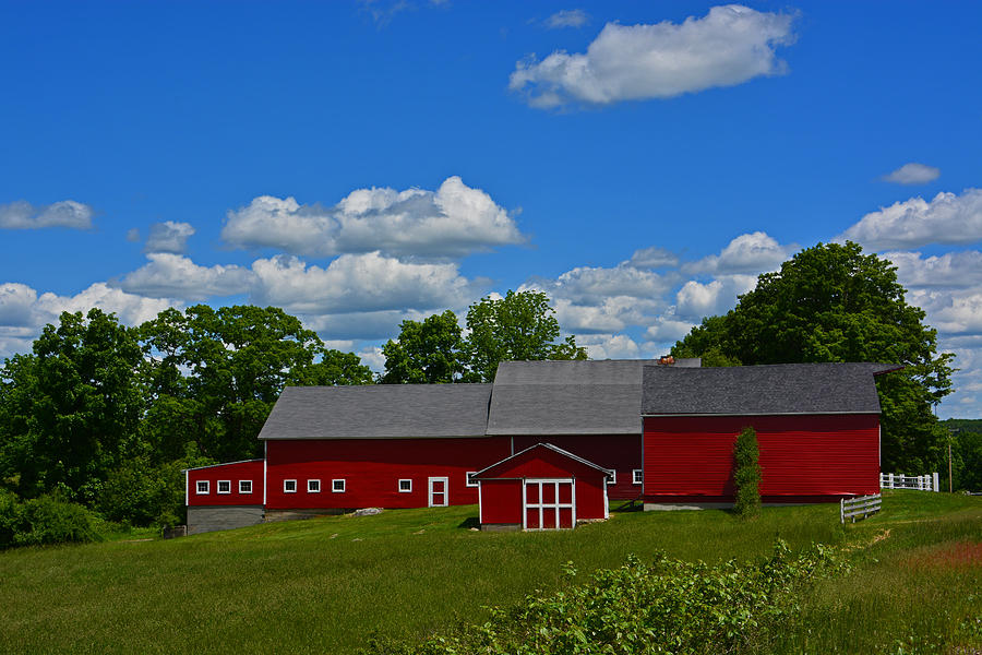 Red barn White clouds Blue sky Photograph by Mike Martin