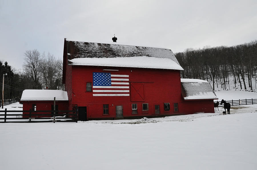 Red Barn with Flag in the Snow Photograph by Bill Cannon