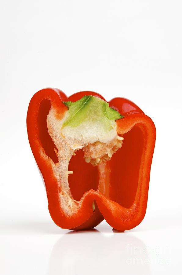 Vegetable Photograph - Red bell pepper cut in half by Bernard Jaubert