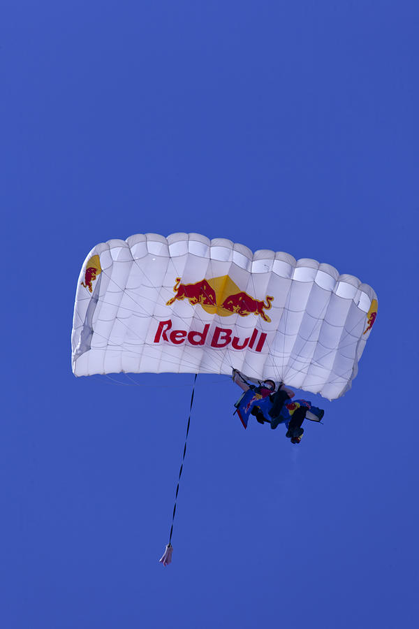 Air Show Photograph - Red Bull Parachute Jumper by Donna Corless