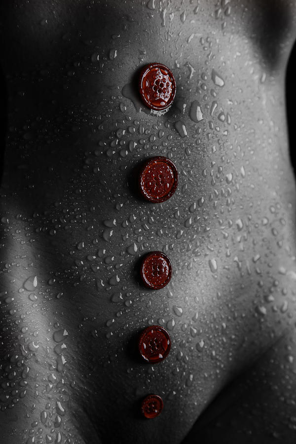 Red Buttons on wet body Photograph by Rod Meier
