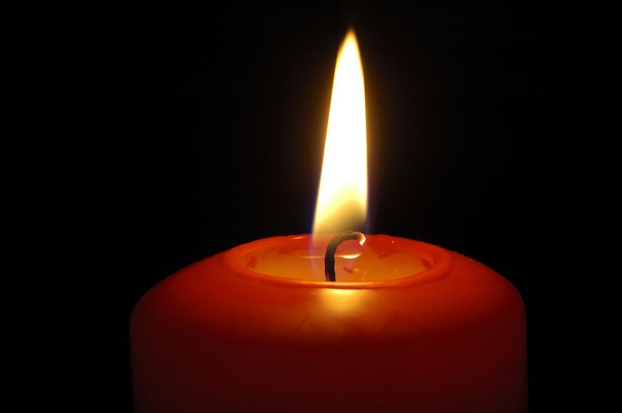 Red Candle Burning Photograph