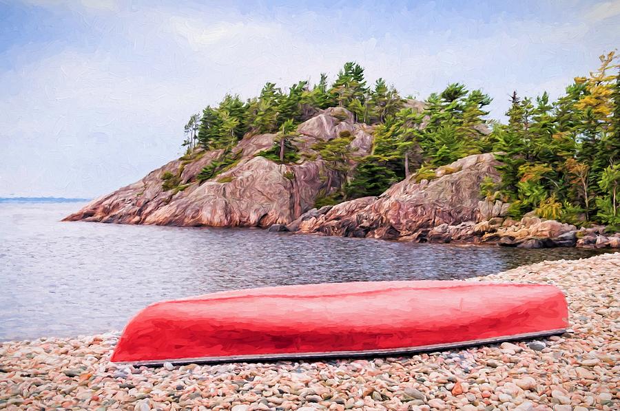 Red canoe on a rocky beach Photograph by Les Palenik