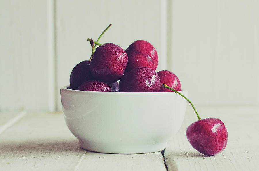 Red Cherries In White Bowl Photograph by Danielle Donders