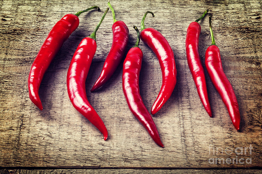 Vegetable Photograph - Red Chillies on Rustic Background by Colin and Linda McKie