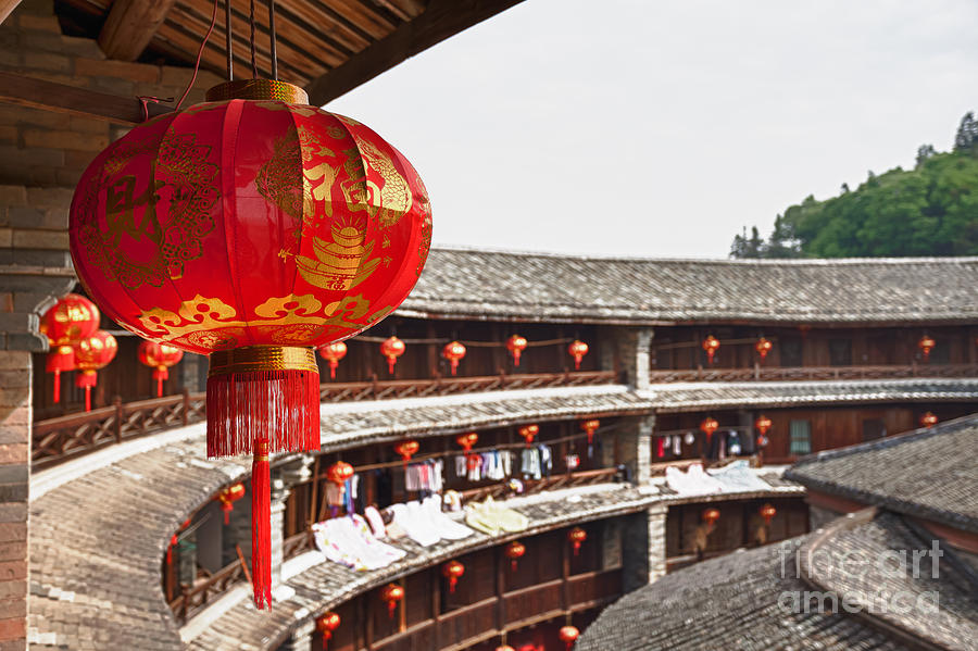Architecture Photograph - Red Chinese lantern in a Hakka Tulou  by Fototrav Print