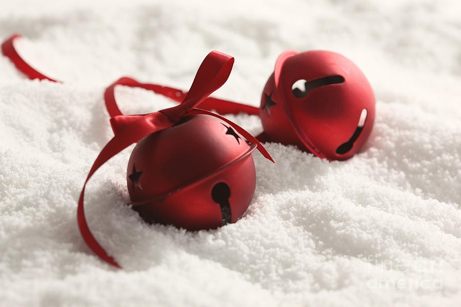 Red Christmas bells with ribbon in snow Photograph by Sandra Cunningham
