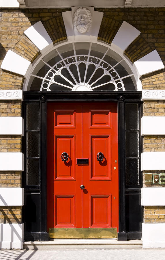 Red door on London home framed in black Photograph by Whitemay