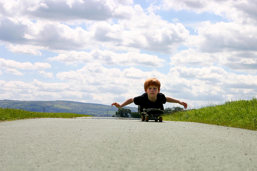 Red Headed Boy Skateboarding Photograph by Image by Catherine MacBride