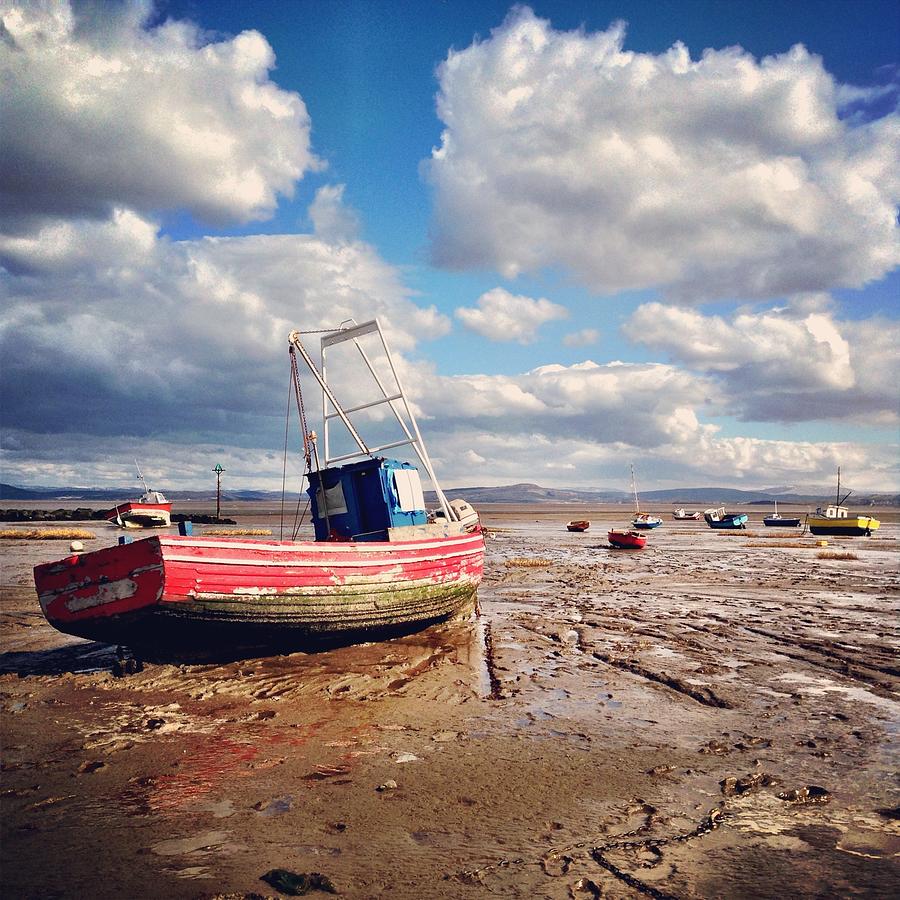 Red Landlocked Boat On Morecombe Bay Photograph by Verity E. Milligan