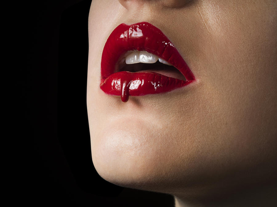 Red lip stick drip, close up Photograph by Jonathan Knowles