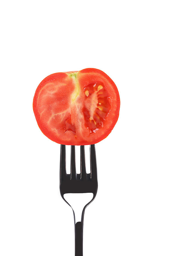 Tomato Photograph - Red ripe tomato on fork. by Oleg Begunenco