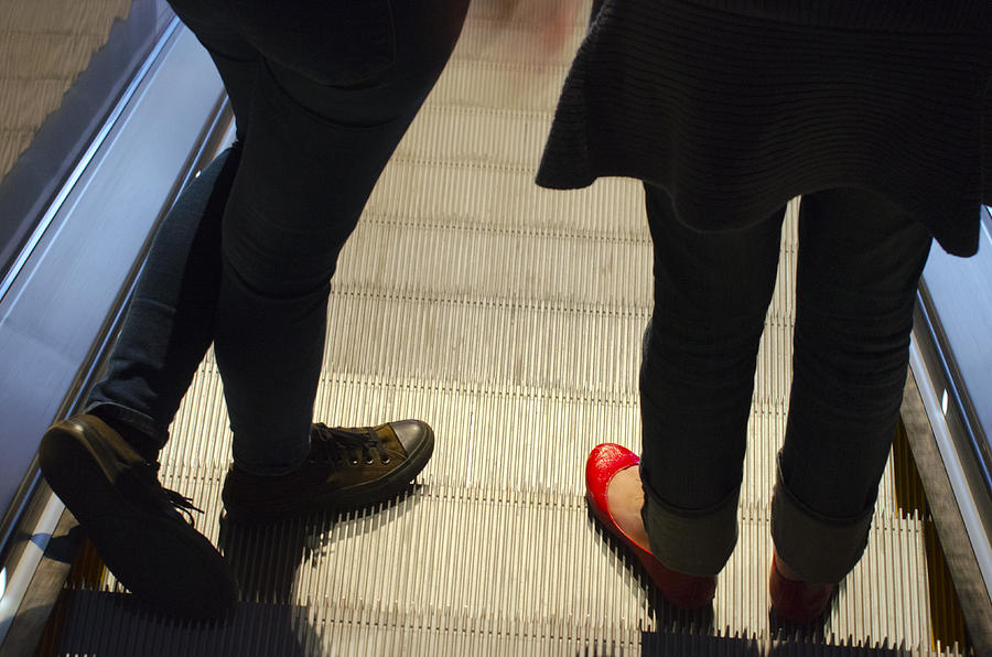 Red Shoe on Escalator Photograph by Lynn Hansen