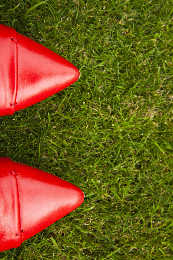 Red shoes on grass Photograph by Jim Orr