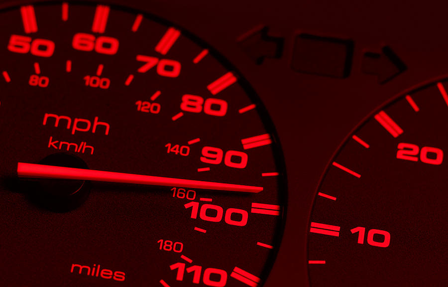 Red speedometer close up Photograph by Peter Dazeley