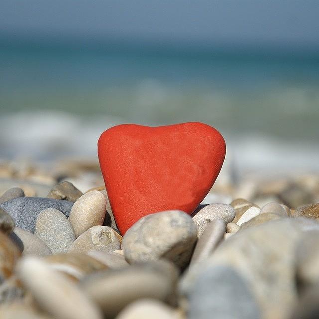 Pebbles Photograph - Red Stone Heart Over Many Pebbles by Adriano La Naia