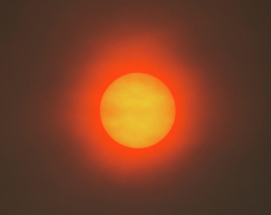 Red Sun Caused By Atmospheric Dust Photograph by Chris Madeley/science Photo Library