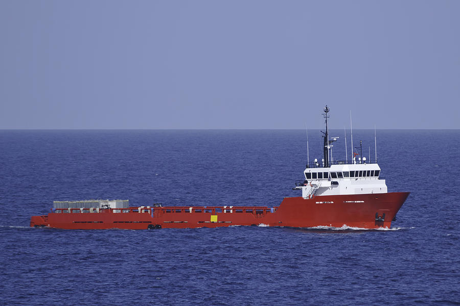 Red Supply Vessel in Blue Ocean Photograph by Bradford Martin