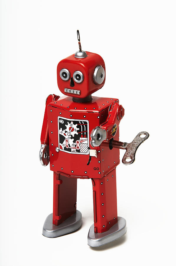 Red tin wind-up robot toy Photograph by Andy Crawford