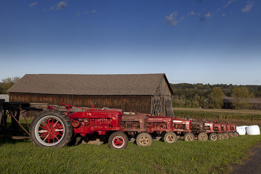 Red tractors and tobacco barn located in Suffield Connecticut Photograph by Carol M Highsmith