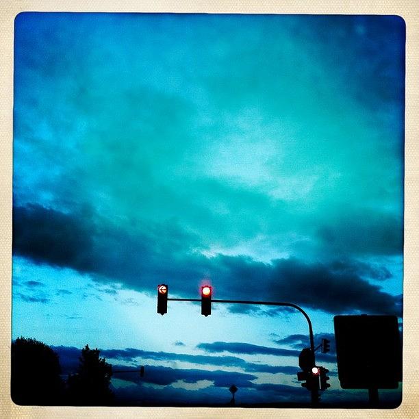 Blue Photograph - Red traffic lights and dark blue sky by Matthias Hauser