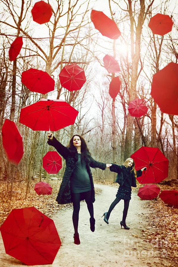 Red umbrellas falling form the sky. Photograph by Yaromir Mlynski