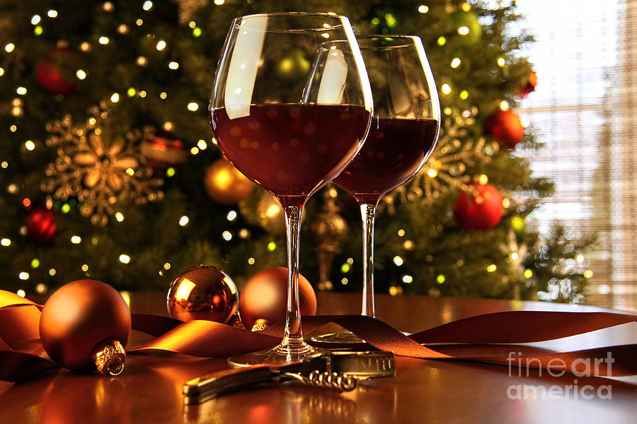 Red wine on table Christmas tree Photograph by Sandra Cunningham